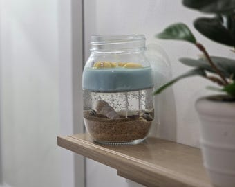 ¡Vela decorativa con forma de océano y conchas reales!