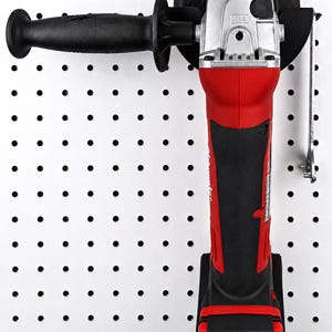 May include: A red and black cordless angle grinder with a black handle and a silver head. The grinder is mounted on a white pegboard. The brand name "Milwaukee" is visible on the tool.
