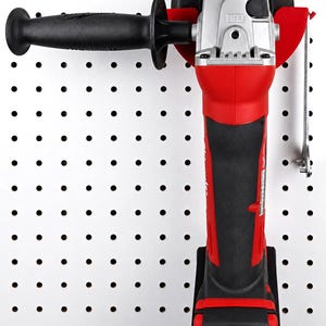 May include: A red and black cordless angle grinder with a black handle and a silver motor housing. The grinder has a black grinding wheel and is labeled "Milwaukee" and "REDLITHIUM". It is mounted on a white pegboard.