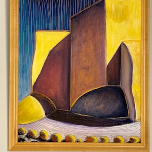 May include: Abstract painting in a gold frame. The artwork features geometric shapes in shades of yellow, brown, and blue. A row of yellow orbs is at the bottom. The background has vertical lines.