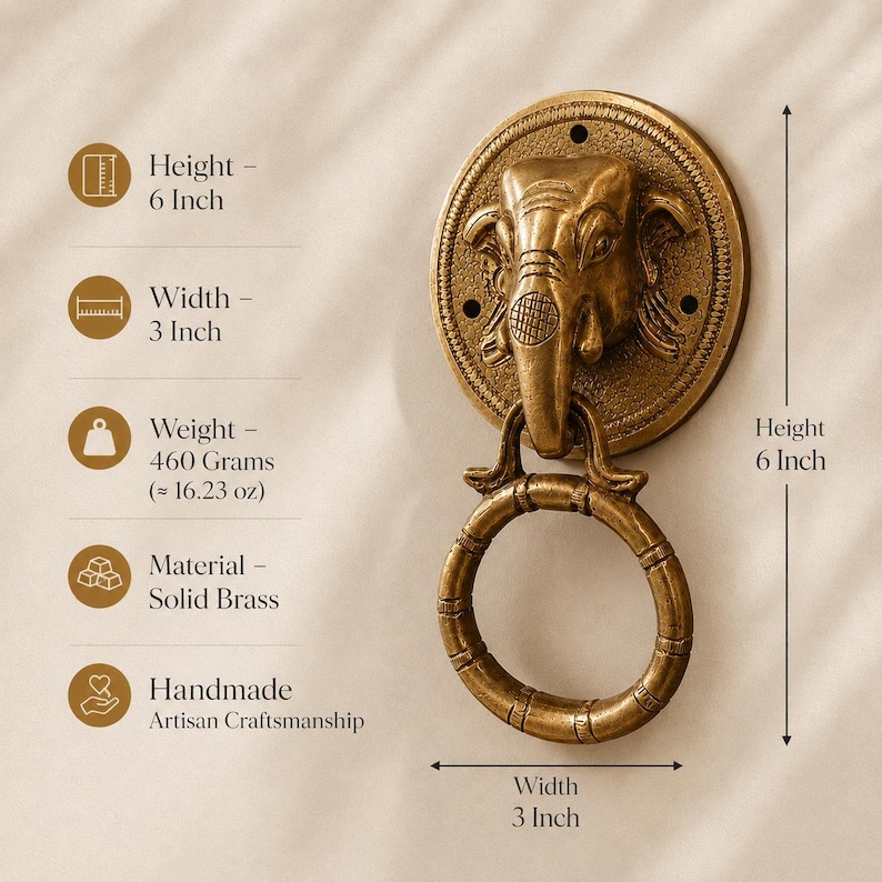 May include: A solid brass door knocker featuring an elephant head design. The handmade knocker is 6 inches in height and 3 inches in width. It weighs 16.23 oz. The knocker has a ring for pulling and is an example of artisan craftsmanship.