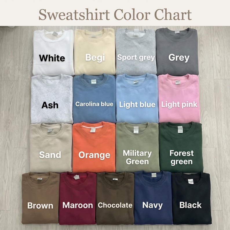 Puede incluir: Una carta de colores de sudaderas que muestra quince sudaderas de cuello redondo dobladas en varios colores s&oacute;lidos, incluyendo blanco, beige, gris deportivo, gris, ceniza, azul carolina, azul claro, rosa claro, arena, naranja, verde militar, verde bosque, marr&oacute;n, granate, chocolate, azul marino y negro.