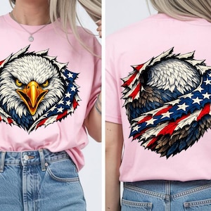 May include: Pale pink t-shirt with a graphic of a bald eagle's head, featuring a yellow beak and intense eyes, set within a design incorporating the American flag. The eagle design is also on the back of the shirt.