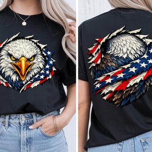 May include: Black t-shirt with a detailed graphic of an American bald eagle. The eagle's head is white with a yellow beak, surrounded by red, white, and blue elements. The design is on the front and back, representing the American flag.