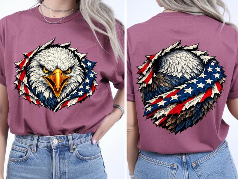 May include: Mauve t-shirt with a detailed graphic of an American bald eagle and a patriotic design. The eagle's head is in the centre, with the American flag design around it. The back of the shirt also features the eagle and flag design.