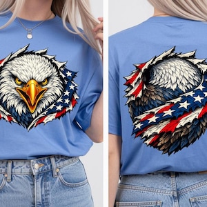 May include: Pale blue t-shirt with a graphic of an American bald eagle. The eagle's head is in the centre, surrounded by a torn-fabric effect with red, white, and blue accents. The back of the shirt also features the eagle design.