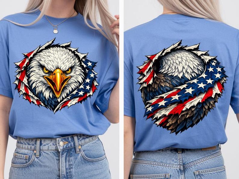 May include: Pale blue t-shirt with a graphic of an American bald eagle. The eagle's head is in the centre, surrounded by a torn-fabric effect with red, white, and blue accents. The back of the shirt also features the eagle design.