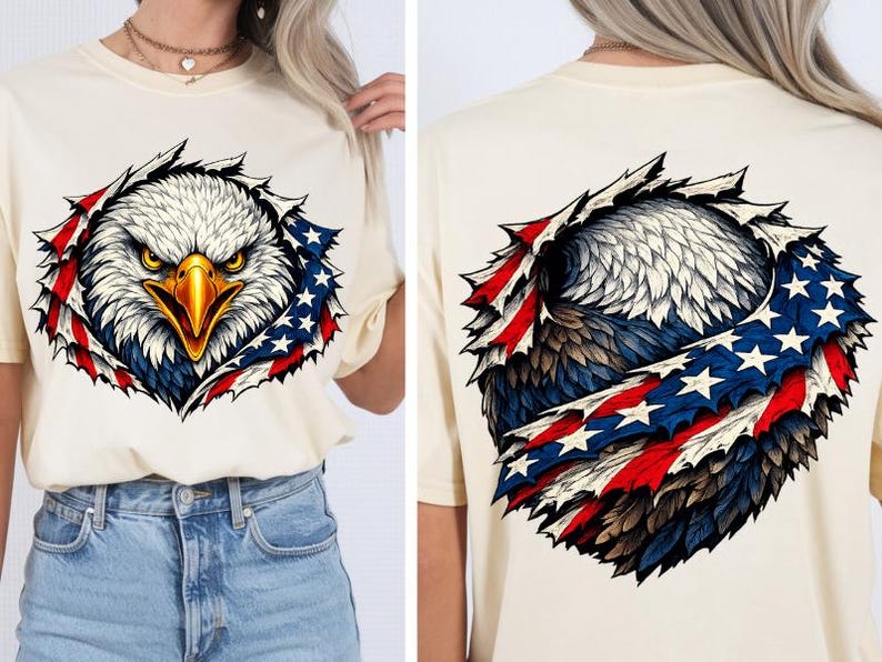 May include: A cream-coloured t-shirt with a graphic of an American bald eagle. The eagle's head and chest are visible, surrounded by a design incorporating the American flag's red, white, and blue colours and stars. The back of the shirt also features the eagle design.