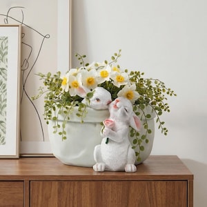 May include: A rustic wooden sign with the text "Welcome to our home" in white lettering. The sign features a distressed finish and a simple, inviting design, perfect for a front porch or entryway.