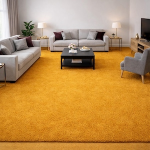 May include: A living room with a vibrant yellow rug covering the floor. Two gray sofas with accent pillows face each other. A black coffee table sits in the center, and a gray armchair is on the right. Lamps and a TV complete the room.