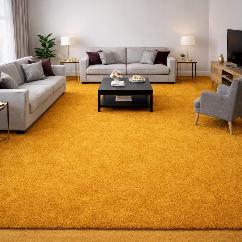May include: A living room with a vibrant yellow rug covering the floor. Two gray sofas with accent pillows face each other. A black coffee table sits in the center, and a gray armchair is on the right. Lamps and a TV complete the room.