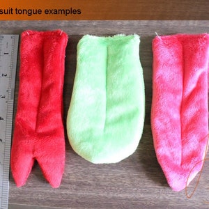 A size comparison to the tongues and what they look like from above.

This position also gives a clearer view of the forked, pointed, straight and rounded shapes of the fursuit and dino mask tongues