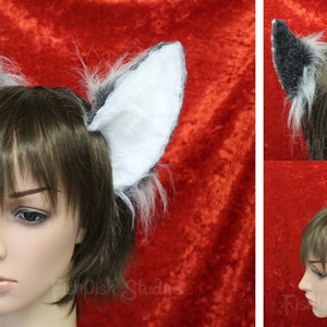 an all round example of our silver and white flexi cat ears. showing the side, back and front

these ears are fixed to a metal headband and have wire along the edge for bending into shape