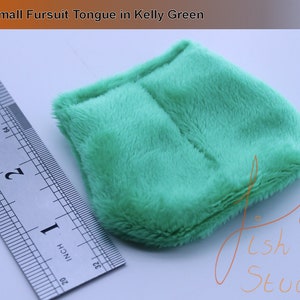 an example of a short rounded fursuit tongue in kelly green