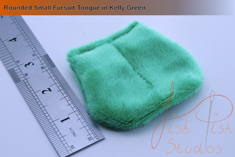 an example of a short rounded fursuit tongue in kelly green