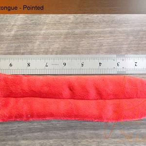 an example of the long pointed fursuit tongue in red