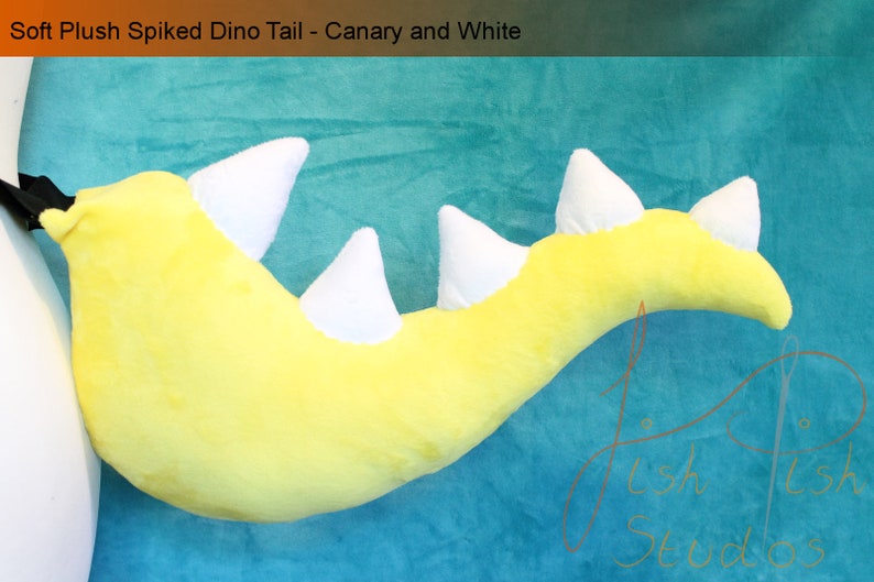 A luxury spiked dinosaur tail perfect for even the most evil of dinosaur princesses.

This is made with soft plush fabric, in canary yellow with five white 3D spikes handsewn along the top