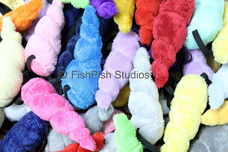 a photo showing a pile of many small unicorn horns in various colours