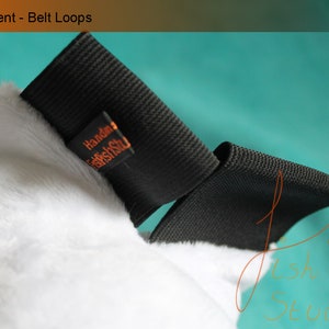 An example of the belt loops used for this tail. As they are made with elastic they fit most belts, or they can be pinned. 

Pins and belts not included.