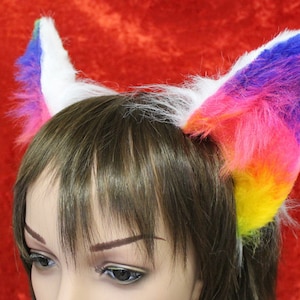 an example of our rainbow and white flexi cat ears

these ears are fixed to a metal headband and have wire along the edge for bending into shape