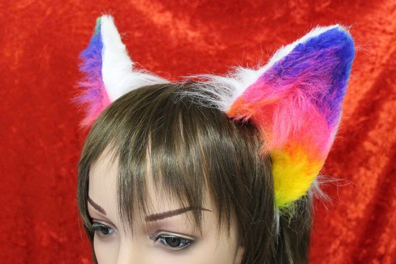 an example of our rainbow and white flexi cat ears

these ears are fixed to a metal headband and have wire along the edge for bending into shape