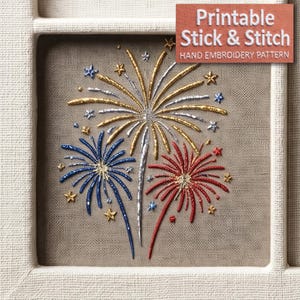 May include: Hand embroidery pattern featuring a colorful fireworks display in red, white, and blue. The design includes gold and silver accents, with the text "Printable Stick & Stitch" and "Hand Embroidery Pattern".