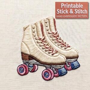 May include: Embroidered image of a pair of vintage roller skates. The skates are off-white with red laces and brown heels. The wheels are pink and blue. The image includes the text "Printable Stick & Stitch Hand Embroidery Pattern."