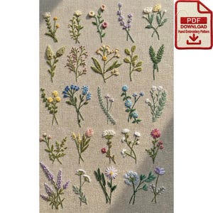 May include: An assortment of embroidered floral designs in various colors, including yellow, blue, pink, and purple, on a beige fabric background. A small red and white PDF download graphic is in the upper right corner. The embroidery features detailed stitching.