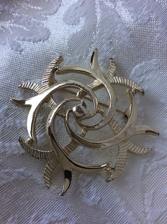 Golden Sarah swirl signed brooch