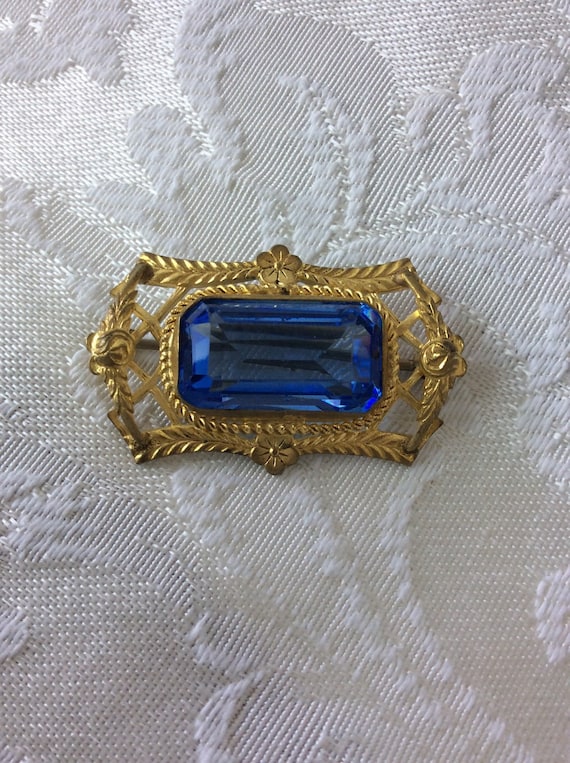 Beautiful blue faceted glass brooch