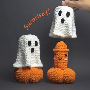 May include: Crocheted Halloween-themed decorations. The image shows three handmade items: two white ghost figures with black eyes and a smiling orange figure. The word "Surprise!!" is written in orange.