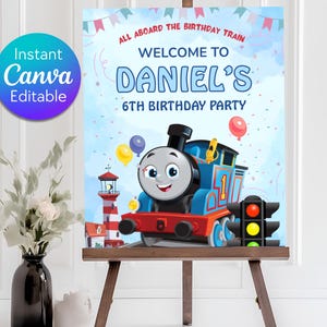 Könnte beinhalten: Ein farbenfrohes Geburtstagsplakat mit einem Zeichentrickzug und dem Text "Willkommen zu Daniels 6. Geburtstagsparty". Das Plakat zeigt Ballons, einen Leuchtturm und eine Ampel. Das Plakat steht auf einer Staffelei.
