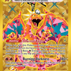 May include: A Charizard ex Pokémon card with a gold background and a vibrant illustration of Charizard. The card features the text "Infernal Reign" and "Burning Darkness", along with other game details. The card is from the 228/197 set.