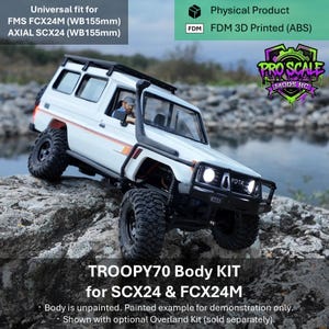 May include: A white TROOPY70 body kit for RC vehicles, compatible with FMS FCX24M and Axial SCX24 with 155mm wheelbase. The FDM 3D printed ABS plastic model features a snorkel, roof rack, and front bumper, shown painted with decals.