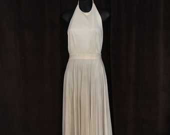 Marilyn Monroe Dress. White Halter top, floor length, full pleated skirt that will fly up over a vent. Backless to the waist.