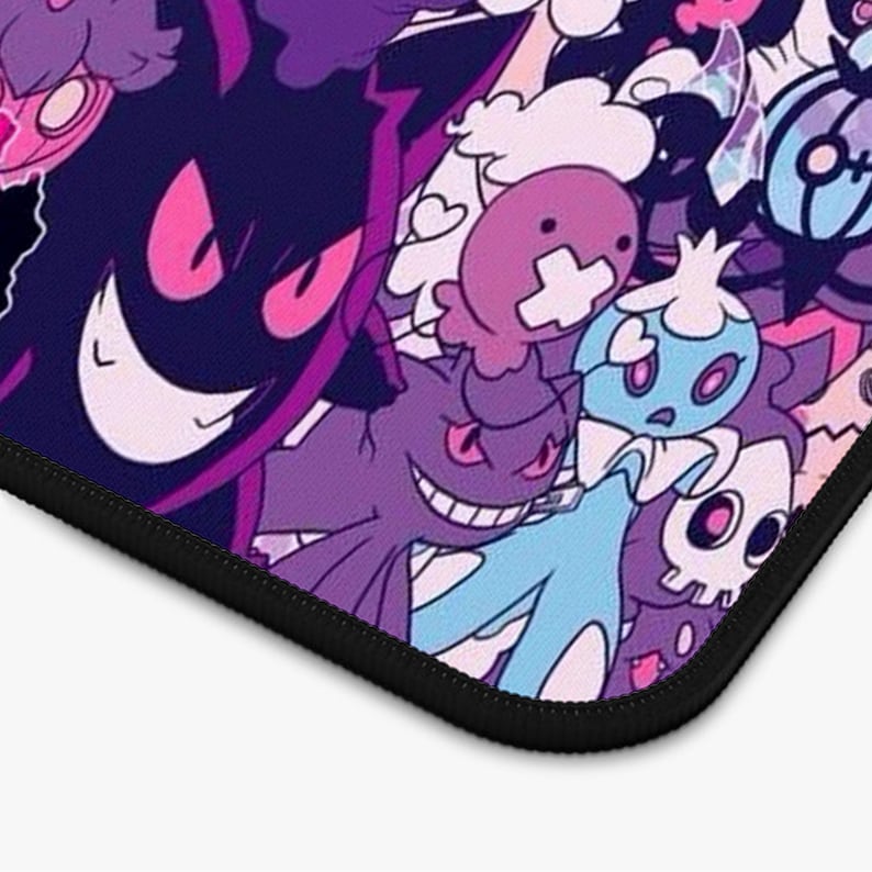May include: A vibrant mouse mat displaying a collection of cartoon characters in purple, pink, blue, and white. The design showcases various monster-like figures with expressive faces and unique shapes. The mouse mat has a black border.