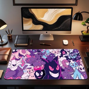 May include: A rectangular mouse mat with a vibrant design of cartoon characters in purple, pink, and blue. The mat is on a dark wooden desk, with a computer monitor and other office supplies in the background. The design is eye-catching.