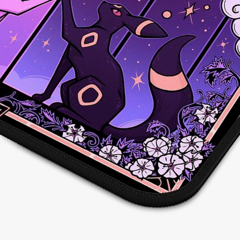May include: A black and purple mousepad featuring a stylized illustration of a dark creature with pink accents, set against a starry purple background. The design includes white floral elements and a black border.