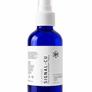 May include: A cobalt blue glass spray bottle with a white pump top and a white label. The label reads LP ACTIVES SIGNAL-CU FOLLICLE SUPPORT TONIC, lists key ingredients like GHK-CU and AHK-CU, and states a volume of 120ml | 4oz.