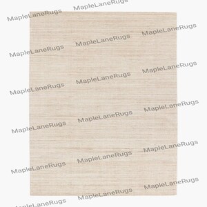 May include: A rectangular, neutral-toned rug with a textured surface. The rug has a light beige color and a subtle, horizontal striped pattern. The words "MapleLaneRugs" are printed diagonally across the rug.