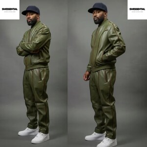 May include: Olive green leather track suit with brown trim. The jacket has a zipper closure and the pants have pockets. The outfit is paired with white sneakers and a navy blue baseball cap. The Swessential logo is in the top right corner.