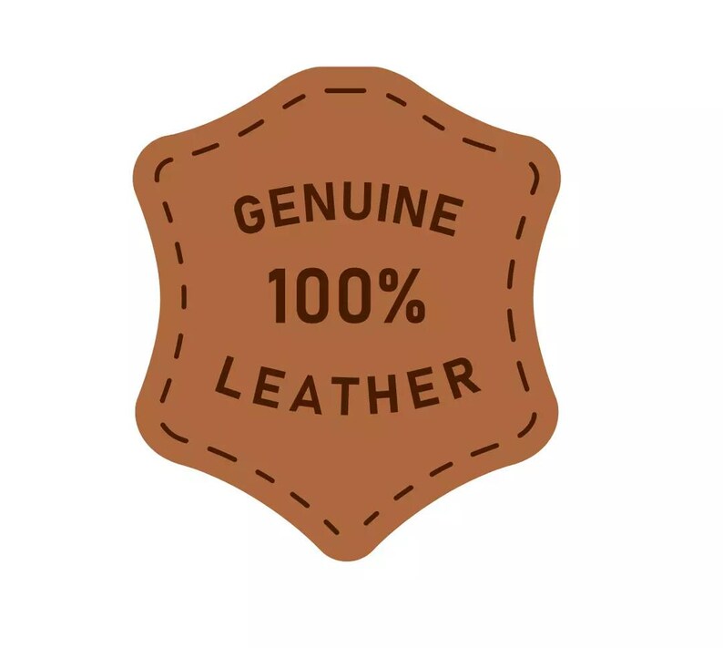 May include: A brown leather tag with the words "GENUINE 100% LEATHER" in dark brown text. The tag has a stitched border and a unique shape, suggesting a product made of genuine leather.