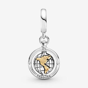 May include: A silver charm with a gold-colored map of the Americas inside a globe design. The charm has a loop at the top for attaching to a bracelet or necklace. The word "PANDORA" is engraved at the bottom.