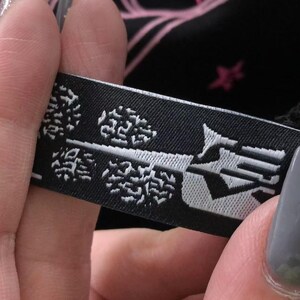 May include: A rustic wooden sign with the text "Welcome to our home" in white lettering. The sign features a distressed finish and a simple, inviting design, perfect for a front porch or entryway.