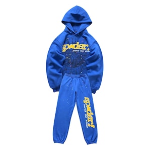 "Bright blue hoodie and jogger set featuring a bold yellow 'spoder' graphic on the front and down the leg, with a subtle spiderweb design and small multicolor star accents. Casual loungewear with elastic cuffs and drawstring waist, perfect for streetwear or cozy outfits."