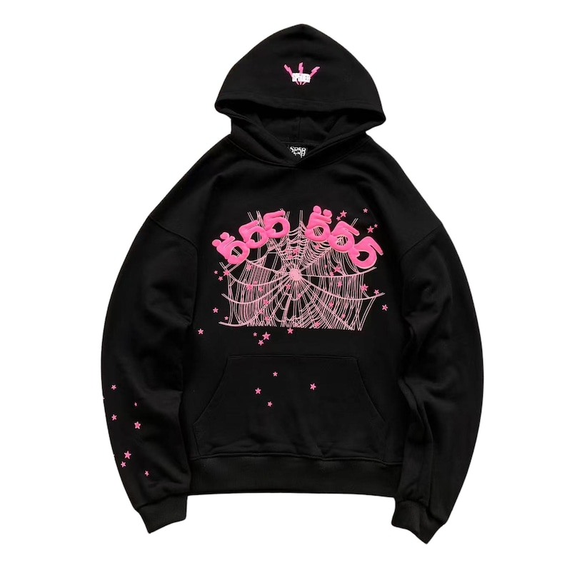 May include: Black hoodie with a pink spiderweb design and the text "666" in pink. The hood features a small pink crown graphic. Pink star accents are on the sleeves and lower front. A classic, comfortable sweatshirt.