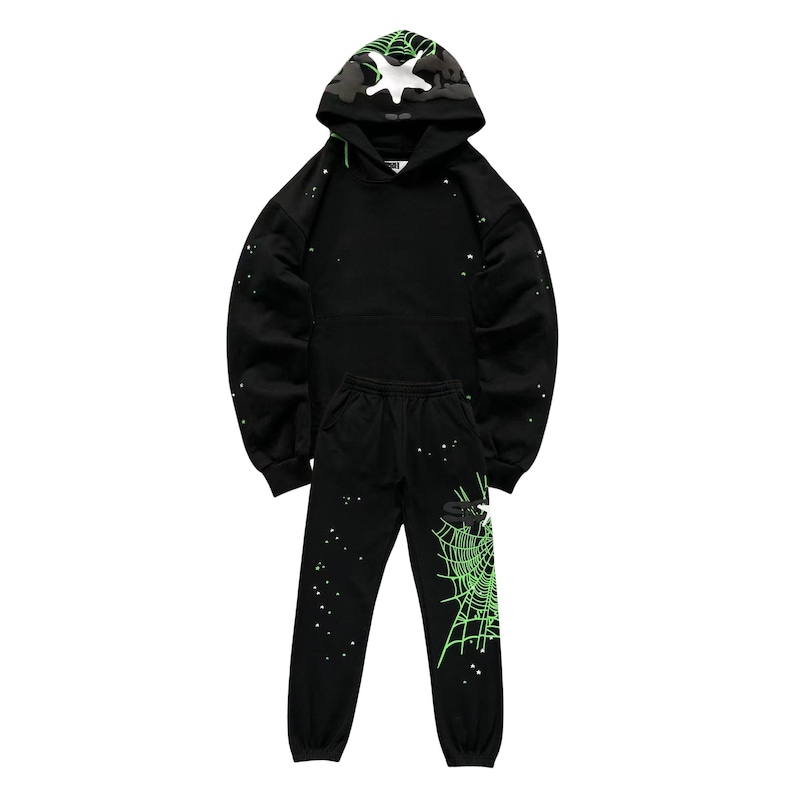 "Black hoodie and jogger set featuring neon green spiderweb graphics and small star accents. The hood has a black-and-white camo design with a white star. Casual loungewear with elastic cuffs and drawstring waist, perfect for streetwear or cozy outfits."