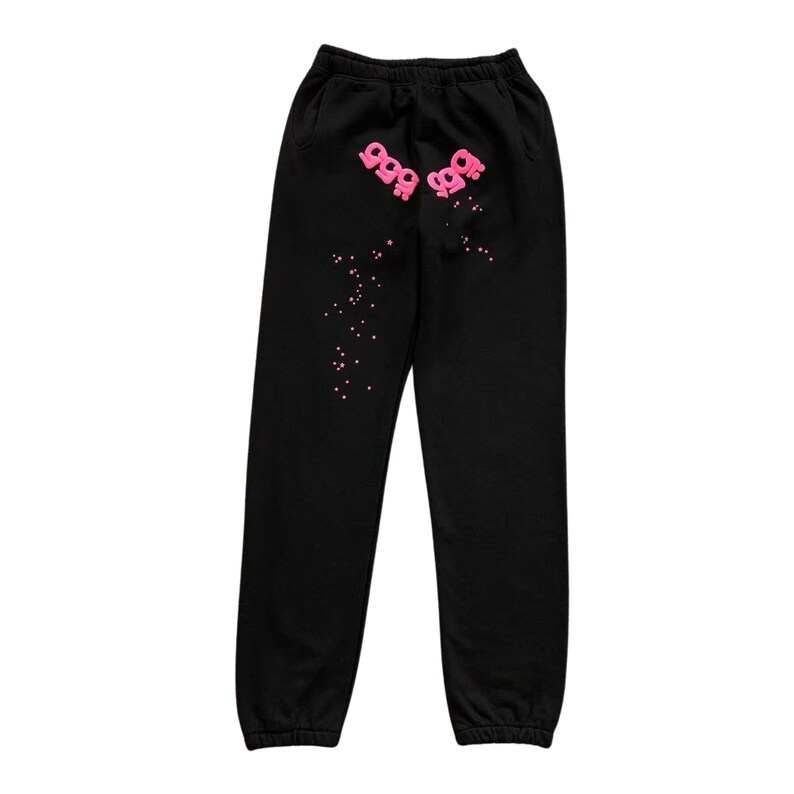 May include: Black sweatpants with a pink graphic design. The design includes the text "999" and small pink dots. The sweatpants have an elastic waistband and cuffs.