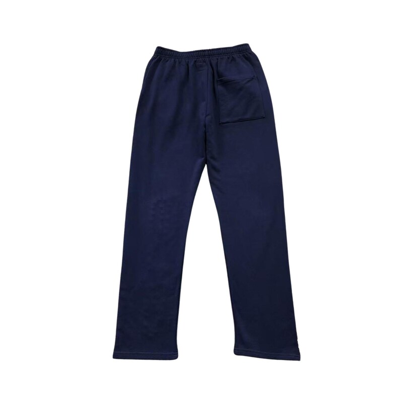 May include: Navy blue sweatpants with a single back pocket. The pants have a relaxed fit and a drawstring waistband. The fabric appears to be a soft, comfortable material, suitable for casual wear or athletic activities.