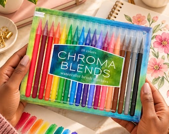 May include: A set of 18 Chroma Blends watercolor brush markers in a clear plastic case. The markers are arranged in a spectrum of colors including red, orange, yellow, green, blue, purple, pink, brown, gray, and black. The label reads 18 colors.